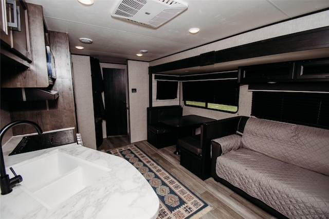 interior space featuring sink and light hardwood / wood-style floors