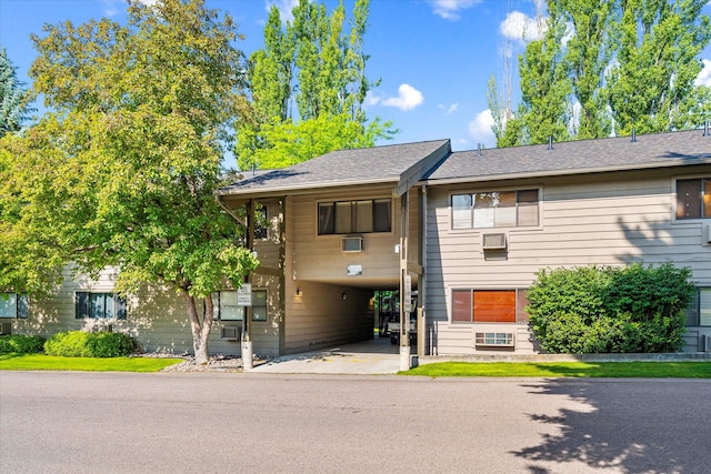 view of front of home featuring a carport