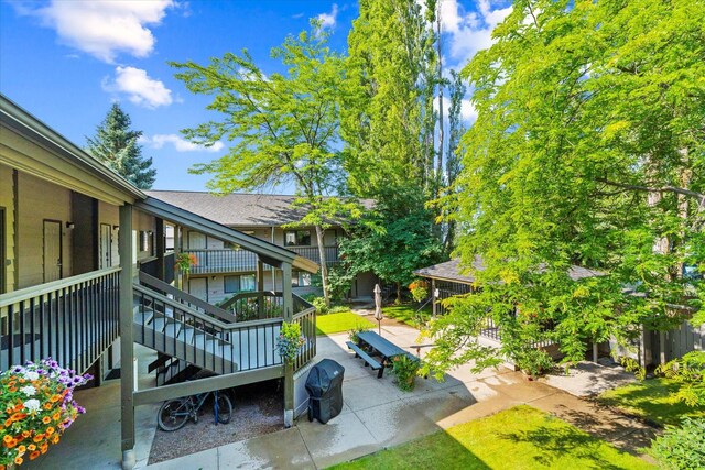 surrounding community with a patio area