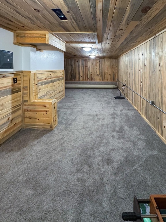 bonus room with wood walls, carpet, and wood ceiling