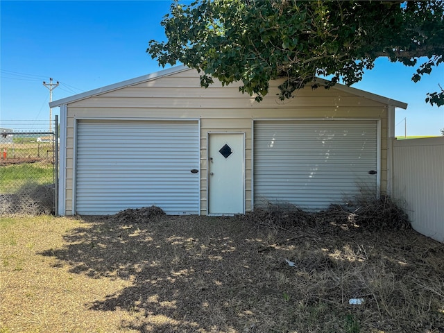 detached garage with fence