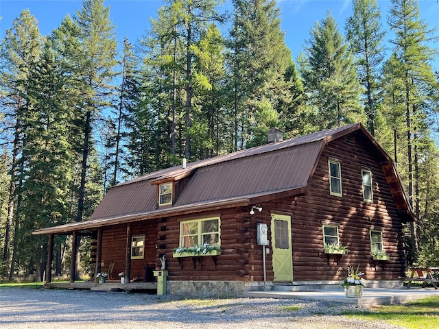 log cabin featuring a porch