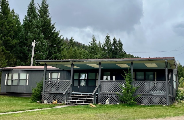 view of front of home with a front lawn and a porch