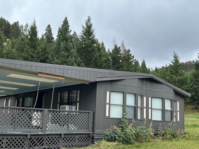 view of side of home with a porch