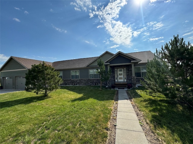 view of front of house with a garage and a front lawn