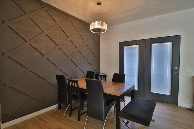 dining space featuring light wood-type flooring