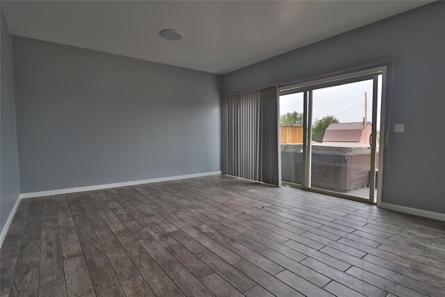 empty room with hardwood / wood-style flooring