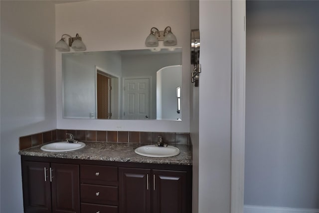 bathroom with double vanity and a sink