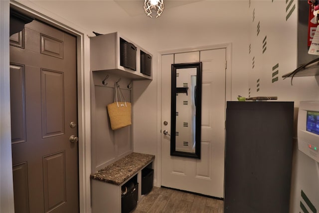 mudroom with dark wood-style floors