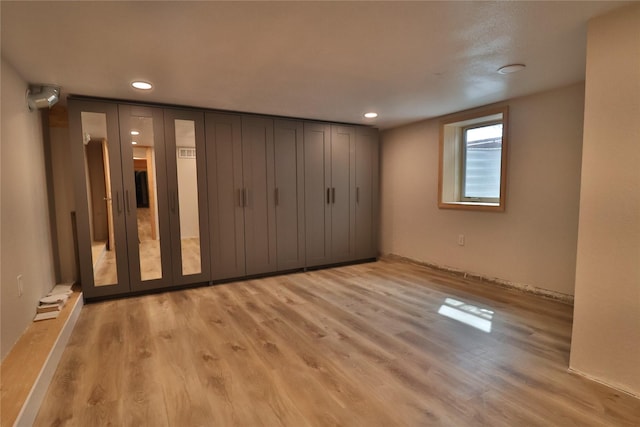 unfurnished bedroom featuring recessed lighting and light wood-style floors