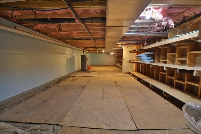 basement featuring electric water heater