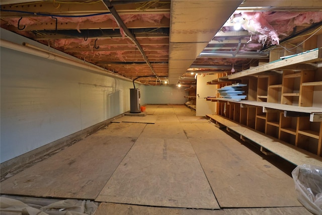 unfinished basement with water heater