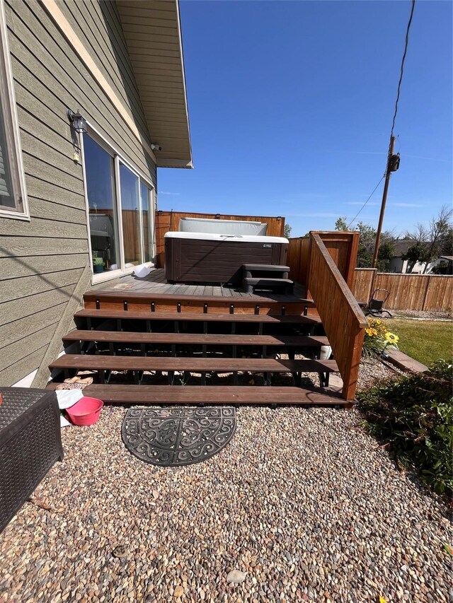 exterior space featuring a hot tub