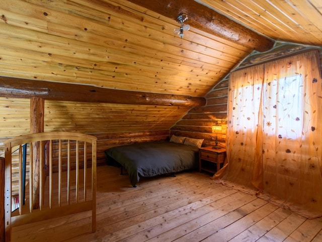 87 Badger Trl, Eureka, MT 59917 - unfurnished bedroom with wood-type flooring, lofted ceiling, wood ceiling, and rustic walls