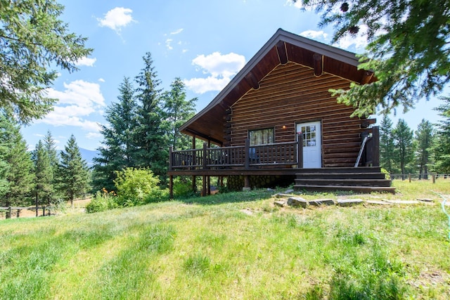 87 Badger Trl, Eureka, MT 59917 - rear view of house featuring a deck