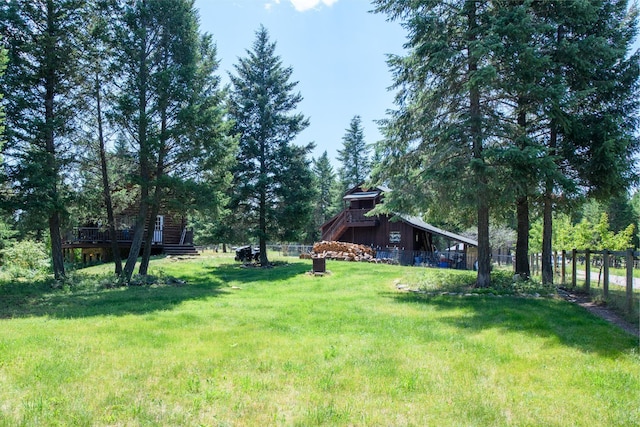 87 Badger Trl, Eureka, MT 59917 - view of yard featuring a wooden deck and a barn