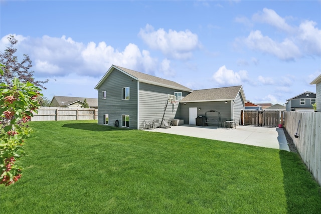 back of property with a patio and a yard