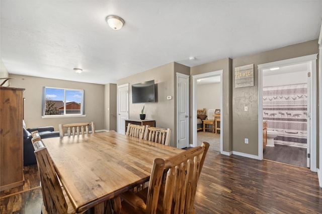 dining room with dark hardwood / wood-style floors