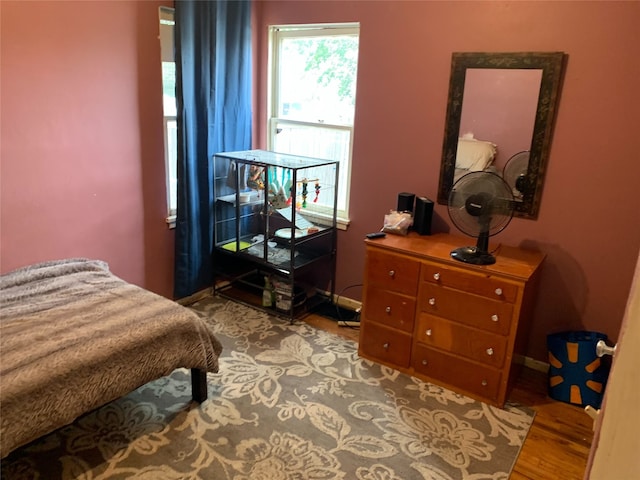 bedroom featuring wood finished floors