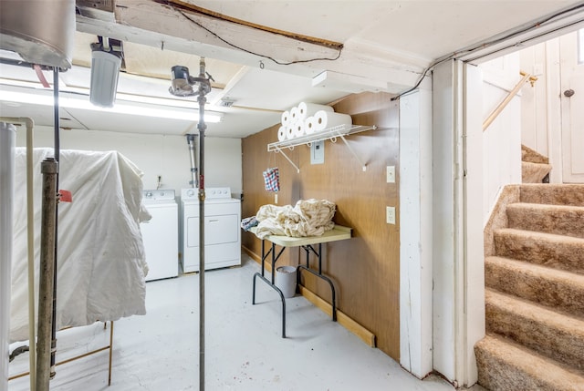 basement featuring washing machine and clothes dryer