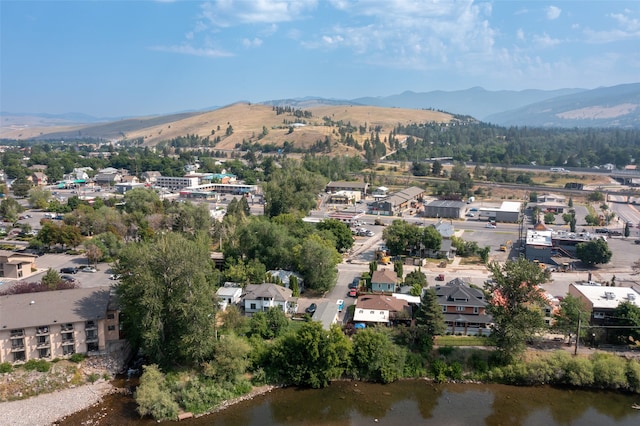 aerial view featuring a water and mountain view