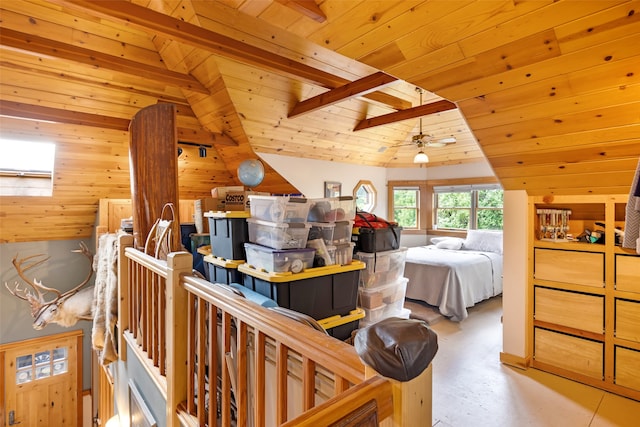 bedroom with wood walls, wooden ceiling, and vaulted ceiling with skylight