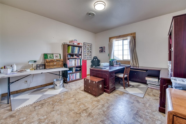 office space with visible vents and baseboards