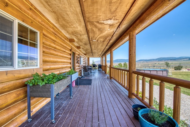 wooden terrace with a mountain view