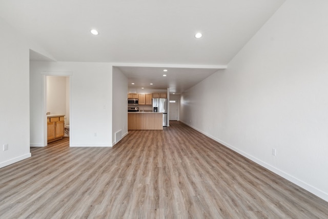 unfurnished living room featuring light wood-type flooring