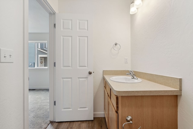 bathroom featuring wood-type flooring and vanity