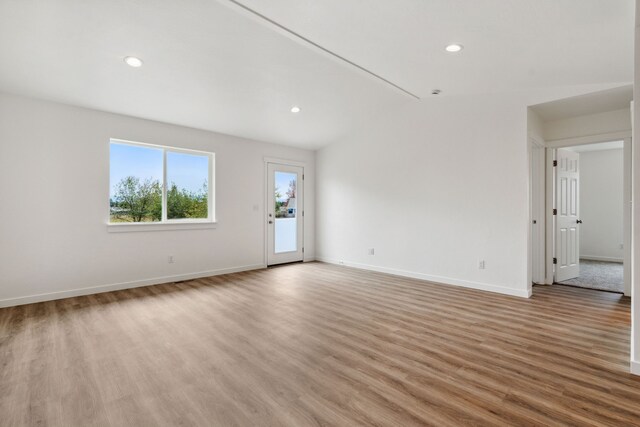 unfurnished room with light hardwood / wood-style floors