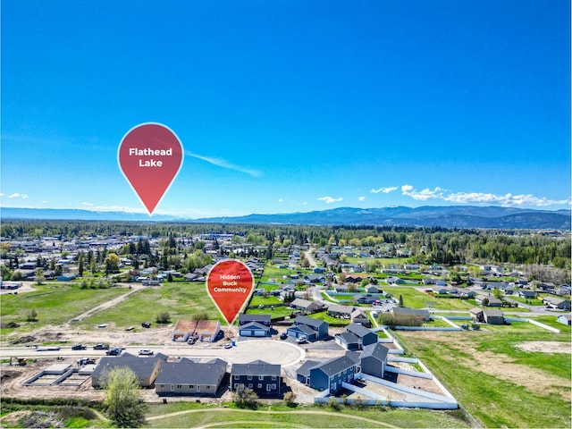 birds eye view of property featuring a mountain view