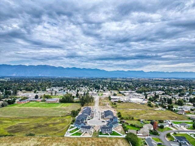 birds eye view of property with a mountain view