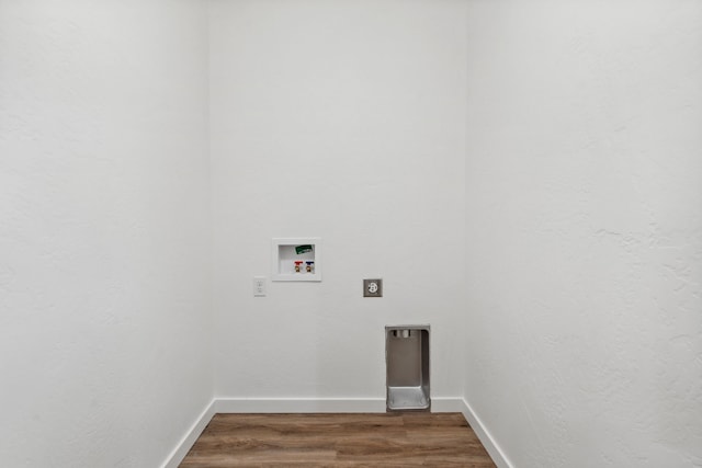 laundry area with hookup for a washing machine, dark wood-type flooring, and hookup for an electric dryer