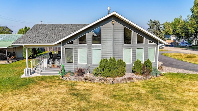 rear view of house with a lawn