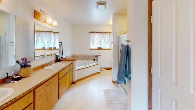 bathroom with vanity and independent shower and bath