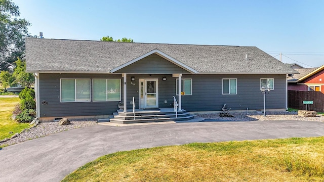 single story home featuring a front yard