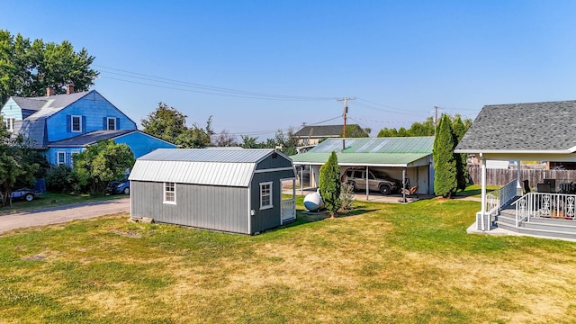 exterior space with a lawn and a carport