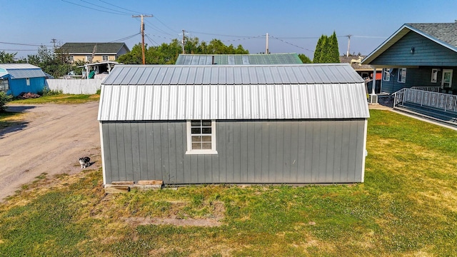 view of outdoor structure featuring a yard