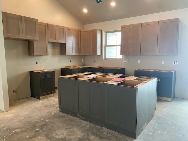 kitchen featuring vaulted ceiling and a center island