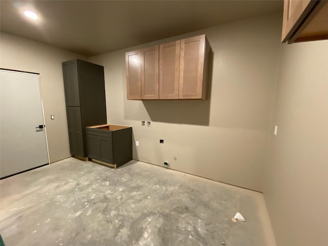 laundry room featuring cabinets and hookup for an electric dryer