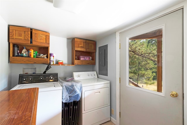 washroom featuring washing machine and dryer and electric panel