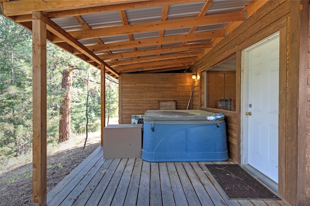 wooden deck featuring a hot tub