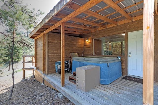 wooden terrace featuring a hot tub