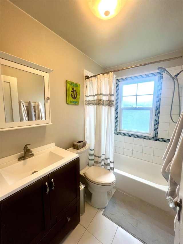 full bathroom featuring tile patterned flooring, toilet, vanity, and shower / tub combo with curtain