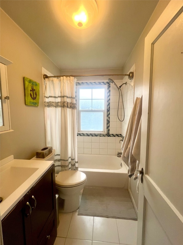 full bathroom featuring tile patterned floors, vanity, toilet, and shower / bath combo