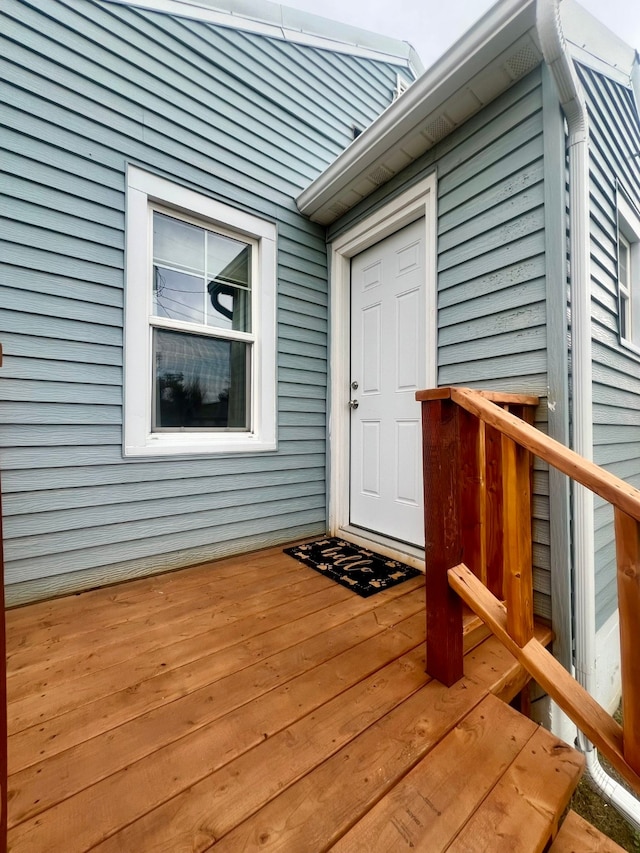 entrance to property with a deck