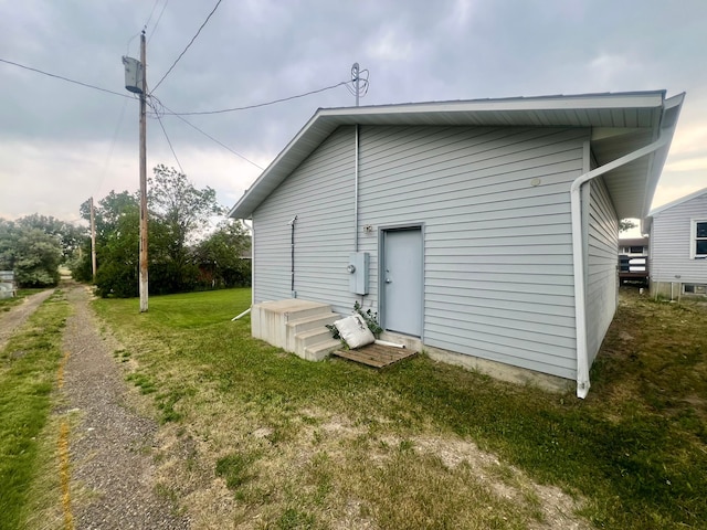 rear view of house with a yard