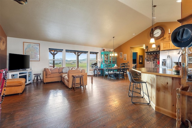 living room with vaulted ceiling and dark hardwood / wood-style floors