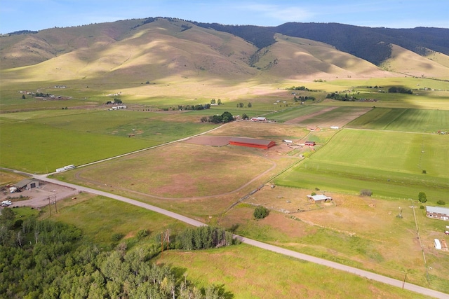 birds eye view of property with a mountain view and a rural view